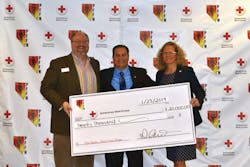 Scott Gorgon (c.), Secretary Treasurer of the PFFN, presents their donation check to the American Red Cross.