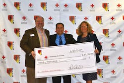 Scott Gorgon (c.), Secretary Treasurer of the PFFN, presents their donation check to the American Red Cross.