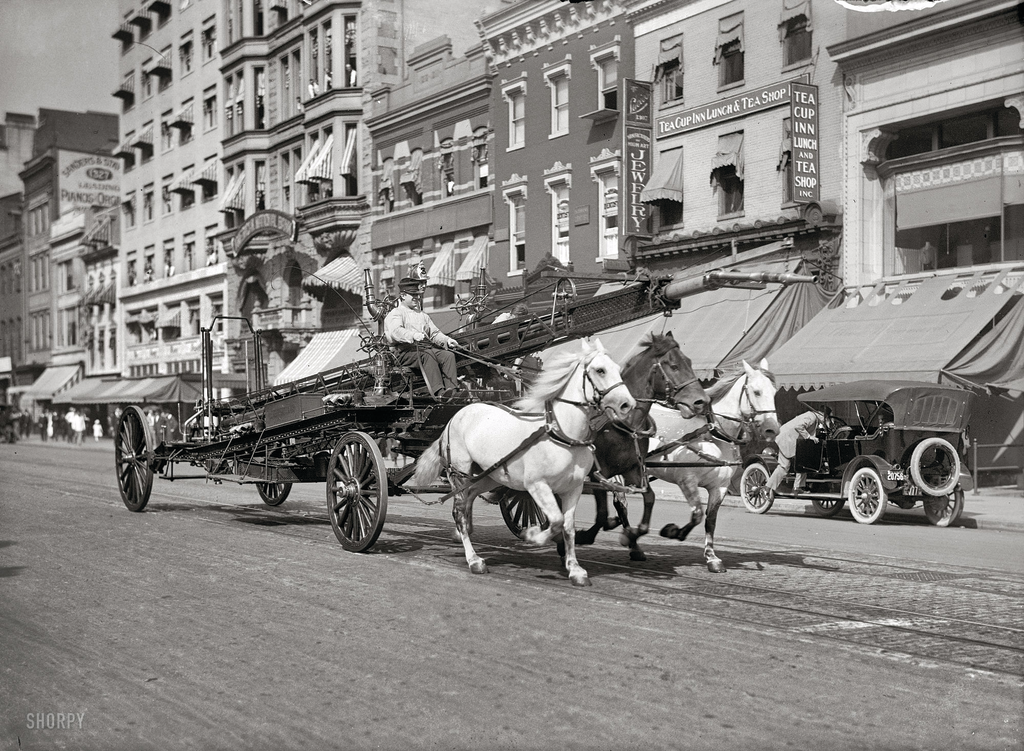 A Washington, DC, water tower races down F Street, circa 1914.