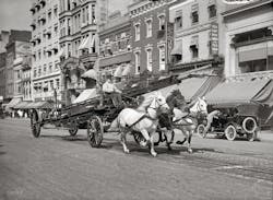 A Washington, DC, water tower races down F Street, circa 1914.