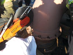 Photo 2: Saws were used to make a relief cut in the last elbow to remove the piece from the vertical pipe. Photo 2: Saws were used to make a relief cut in the last elbow to remove the piece from the vertical pipe.