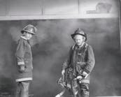 AUG. 23, 1975 &ndash; Station 68 Captain Alan Maas and Volunteer Captain Joe Gay at a 2-11 warehouse fire at SW Freeway and Hillcroft.