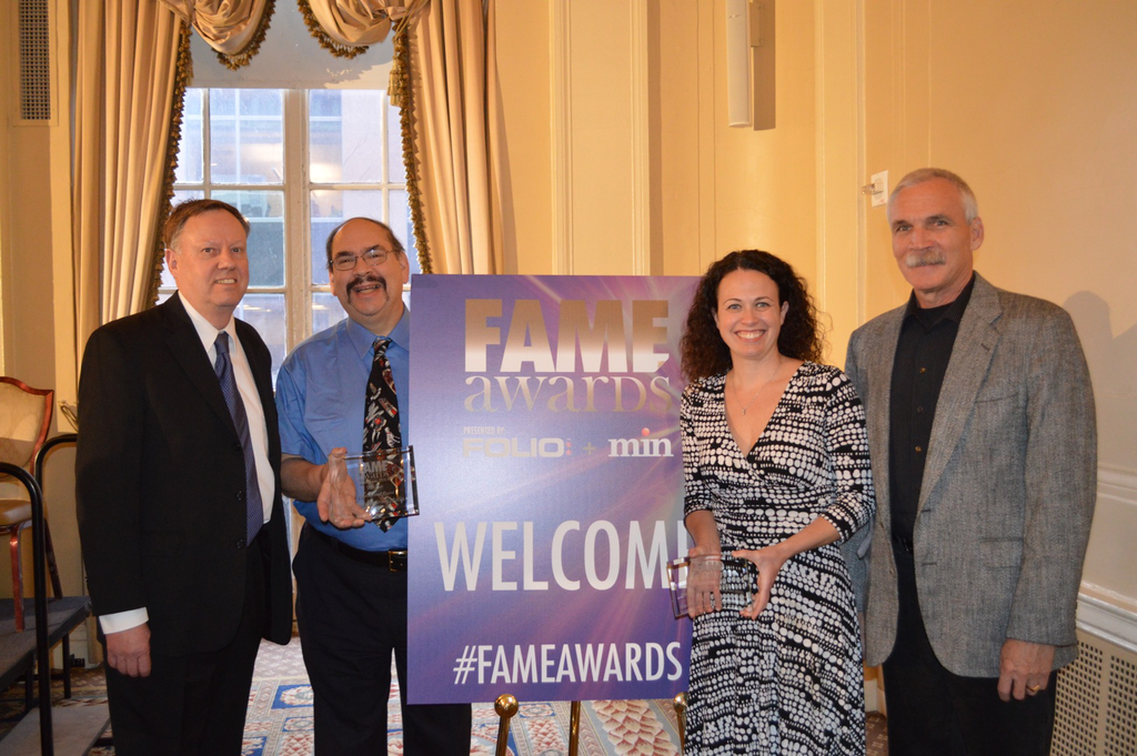 Accepting the award in New York City are Associate Publisher Jeff Barrington (left to right), Editor-in-Chief Harvey Eisner, Managing Editor Elizabeth Neroulas and program manager Paul Hashagen.
