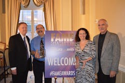 Accepting the award in New York City are Associate Publisher Jeff Barrington (left to right), Editor-in-Chief Harvey Eisner, Managing Editor Elizabeth Neroulas and program manager Paul Hashagen.