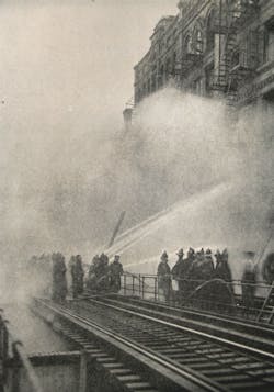 Fifty New York City firemen were overcome while battling a blaze in a cheese warehouse on Greenwich Street in Manhattan on July 17, 1921. The Ninth Avenue elevated subway was shut down for six hours to help firemen battle the fire. Fifty New York City firemen were overcome while battling a blaze in a cheese warehouse on Greenwich Street in Manhattan on July 17, 1921. The Ninth Avenue elevated subway was shut down for six hours to help firemen battle the fire.