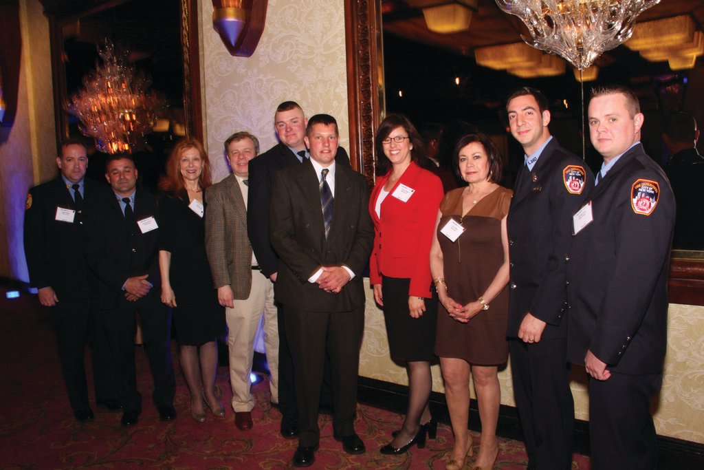 FDNY firefighter Robert Wiedmann (center) with nine of the blood donors who saved his life at New York Blood Center's annual Long Island donor recognition awards dinner.
