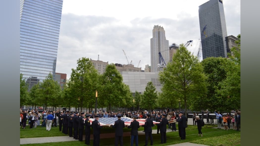 The National 9/11 flag is shown prior to placement.