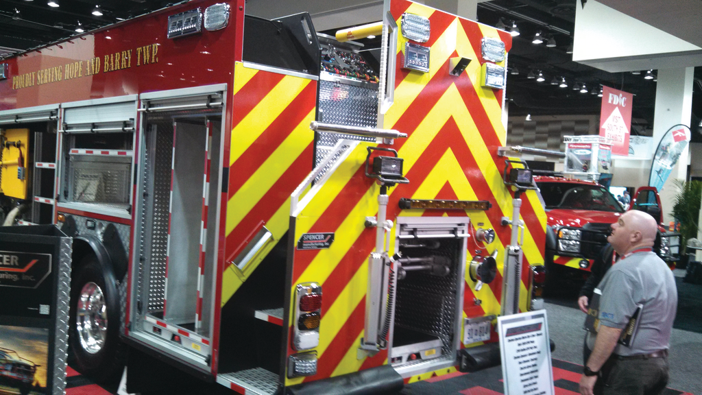 Stairs on each side side at the rear provide access to the elevated rear pump controls on Delton's pumper.