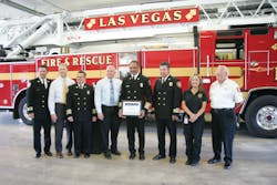 Las Vegas Fire Chief William McDonald (center, holding award) along with staff members of LVFR accepted the American Heart Association&apos;s Mission: Lifeline EMS Bronze Award from representatives from the American Heart Association.
