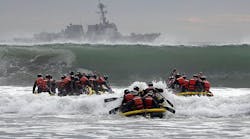 U.S. Navy SEAL students participate in Surf Passage at Naval Amphibious Base Coronado.