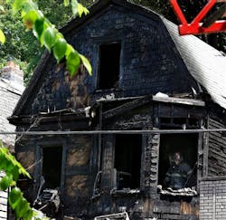 Firefighters pick through the rubble of a burned out home as they look for clues to a fire that authrities say killed six people in Newark, N.J., Sunday, June 15, 2014. The Essex County prosecutor's office says the fast-moving fire that roared through a single-family home in New Jersey's largest city, broke out at around 4 a.m. Sunday. Firefighters pick through the rubble of a burned out home as they look for clues to a fire that authrities say killed six people in Newark, N.J., Sunday, June 15, 2014. The Essex County prosecutor's office says the fast-moving fire that roared through a single-family home in New Jersey's largest city, broke out at around 4 a.m. Sunday.