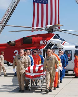 Flight crew members escort the body of LAFD Pilot/Paramedic Brian Lee, who died in an off-duty plane crash. Flight crew members escort the body of LAFD Pilot/Paramedic Brian Lee, who died in an off-duty plane crash.