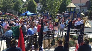 Dozens gathered as the West Roxbury as the playground was dedicated to Boston fire Lt. Edward J. Walsh Jr. and Michael R. Kennedy.