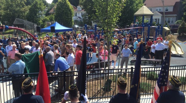 Dozens gathered as the West Roxbury as the playground was dedicated to Boston fire Lt. Edward J. Walsh Jr. and Michael R. Kennedy.