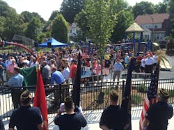 Dozens gathered as the West Roxbury as the playground was dedicated to Boston fire Lt. Edward J. Walsh Jr. and Michael R. Kennedy. Dozens gathered as the West Roxbury as the playground was dedicated to Boston fire Lt. Edward J. Walsh Jr. and Michael R. Kennedy.