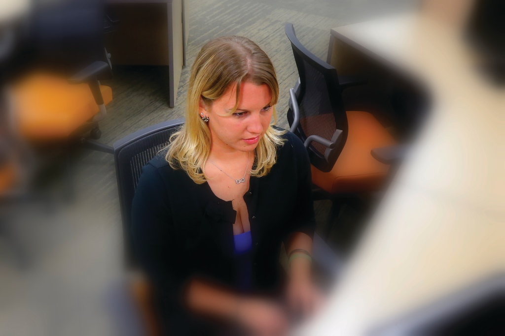 Jill Roberts, a graduate student at Eastern Kentucky University, works on a computer terminal in the Stratton Building Computer Library. Students must be careful to avoid even inadvertent incidents of unauthorized copying of source materials that could jeopardize their academic and fire service careers.