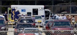 Workers evacuate the GM plant in Marion, Ind. after an explosion.