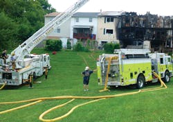 This fire recently ripped through five townhomes in Brunswick, Md. Here, apparatus had to drive over several hundred feet of grass to access the rear of the structures.