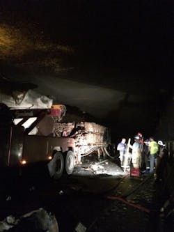 Workers clean up debris after the fire in the East River Mountain Tunnel was extinguished. Workers clean up debris after the fire in the East River Mountain Tunnel was extinguished.