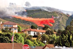 Air Tanker-910 (VLAT DC-10) drops a load of retardant to protect homes in the City of Lompoc, CA, on May 13, 2014. At the same time, structure-protection engines kept watch on the advance of the fire as part of a mutual aid structure-protection strike team. Air Tanker-910 (VLAT DC-10) drops a load of retardant to protect homes in the City of Lompoc, CA, on May 13, 2014. At the same time, structure-protection engines kept watch on the advance of the fire as part of a mutual aid structure-protection strike team.