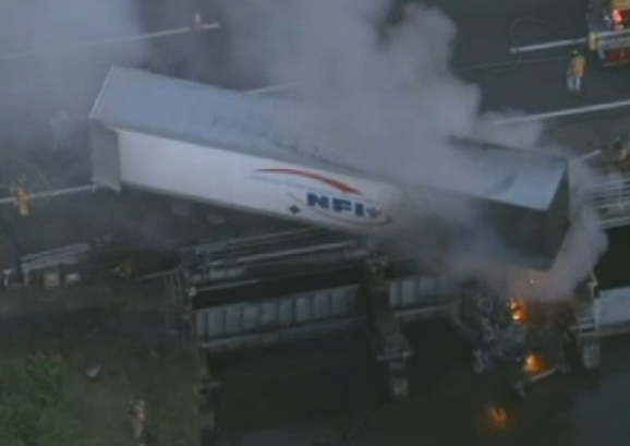 The driver of this rig was rescued by troopers.