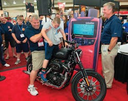 Frank Hrbek Jr. (with his son, Frank III) won the Harley-Davidson giveaway from Unification at Firehouse Expo in Baltimore.