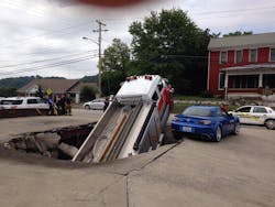 The funeral home parking lot gave way. The funeral home parking lot gave way.