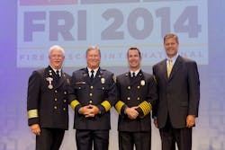 Pictured from left to right: Fire Chief Bill Metcalf (IAFC President), 2014 Career Fire Chief Honoree Alan J. Martin, 2014 Volunteer Fire Chief Honoree Chris Barron, and Jim Johnson, Oshkosh Corporation executive vice president and president, Fire &amp; Emergency.