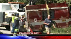 Workers clean up the scene after the Milton fire engine crashed Friday. Workers clean up the scene after the Milton fire engine crashed Friday.