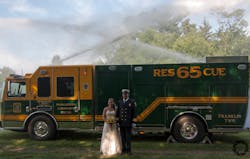 Franlintown &amp; Community Fire Company members Lt. Kaitlin Stough and Deputy Wilbur Stough Jr. pose in front of the new rescue truck at their wedding on June 28. The couple successfully pushed back an attempt to restrict use of apparatus for &apos;personal gain.&apos;