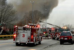 Apparatus, especially engines, arriving on the scene of multiple alarms, should consider backing to better position themselves if they have to go to work. In this instance, since the engine in the foreground did not lay a supply line, it is in a relatively useless position if they are ordered to provide additional lines without a lot of additional maneuvering. The engine right behind it has backed in, and will be able to quickly stretch lines if needed. Apparatus, especially engines, arriving on the scene of multiple alarms, should consider backing to better position themselves if they have to go to work. In this instance, since the engine in the foreground did not lay a supply line, it is in a relatively useless position if they are ordered to provide additional lines without a lot of additional maneuvering. The engine right behind it has backed in, and will be able to quickly stretch lines if needed.