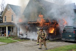 This fire was caused by an extension cord pinched by a sofa. The cord went to a power strip for Christmas tree lights.