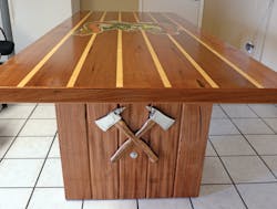 Doors were used as the table tops and legs for Station 2’s dining table, axes crossed on the sides and a ladder underneath. Doors were used as the table tops and legs for Station 2’s dining table, axes crossed on the sides and a ladder underneath.
