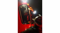 A Detroit firefighter looks at the damaged windshield of Squad 3. Had the brick fallen a second later, the officer may have been seriously injured. A Detroit firefighter looks at the damaged windshield of Squad 3. Had the brick fallen a second later, the officer may have been seriously injured.