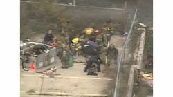 Firefighters and medics tend to the injured firefighters in Detroit Wednesday morning. Firefighters and medics tend to the injured firefighters in Detroit Wednesday morning.