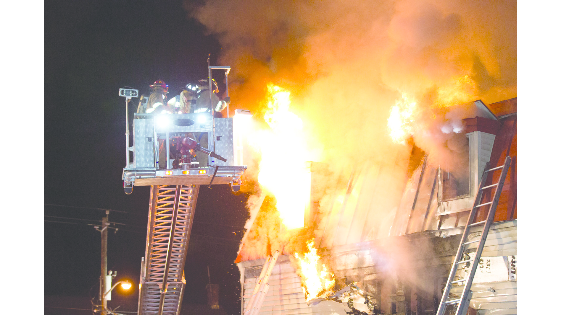 Sept. 16: Florida, NY &ndash; A Warwick Hook & Ladder crew is feeling the heat as fire blows out the second-floor window while operating at a three-alarm fire.