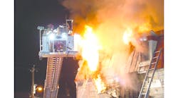 Sept. 16: Florida, NY – A Warwick Hook & Ladder crew is feeling the heat as fire blows out the second-floor window while operating at a three-alarm fire. Sept. 16: Florida, NY – A Warwick Hook & Ladder crew is feeling the heat as fire blows out the second-floor window while operating at a three-alarm fire.