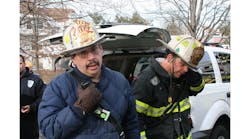 Firehouse Editor Emeritus Harvey Eisner works the scene of a fire with Robert Moran in the early 2000s.