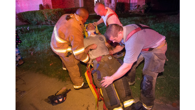 A Fort Worth firefighter is tended to after being caught in a ceiling collapse.