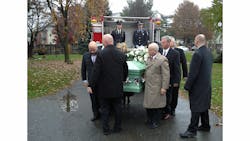 Dr. John Bryan, FPE, is carried to his final resting place.