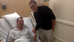 Officer Mark Kimsey thanks Joe Chambers for pulling him from his burning cruiser. Officer Mark Kimsey thanks Joe Chambers for pulling him from his burning cruiser.