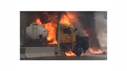 Video captured the driver of a tanker, whose head can be seen in this screengrab, escaping from his burning rig.