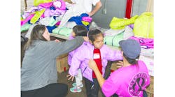 FXFRD distributed new winter coats and sneakers to area children.