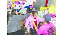 FXFRD distributed new winter coats and sneakers to area children. FXFRD distributed new winter coats and sneakers to area children.