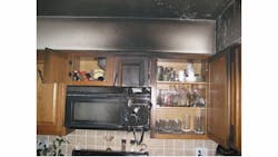 Photo 5: The soffit area above the kitchen and bathroom cabinets is a common area for fire to spread unchecked. Crews need to open that area to assure the fire has not traveled. Photo 5: The soffit area above the kitchen and bathroom cabinets is a common area for fire to spread unchecked. Crews need to open that area to assure the fire has not traveled.