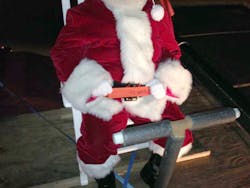 When Santa rode a fire truck during the 2014 Christmas parade, he was seated and belted, thanks to Dr. Burton Clark and the Oak Ridge Fire Department. When Santa rode a fire truck during the 2014 Christmas parade, he was seated and belted, thanks to Dr. Burton Clark and the Oak Ridge Fire Department.