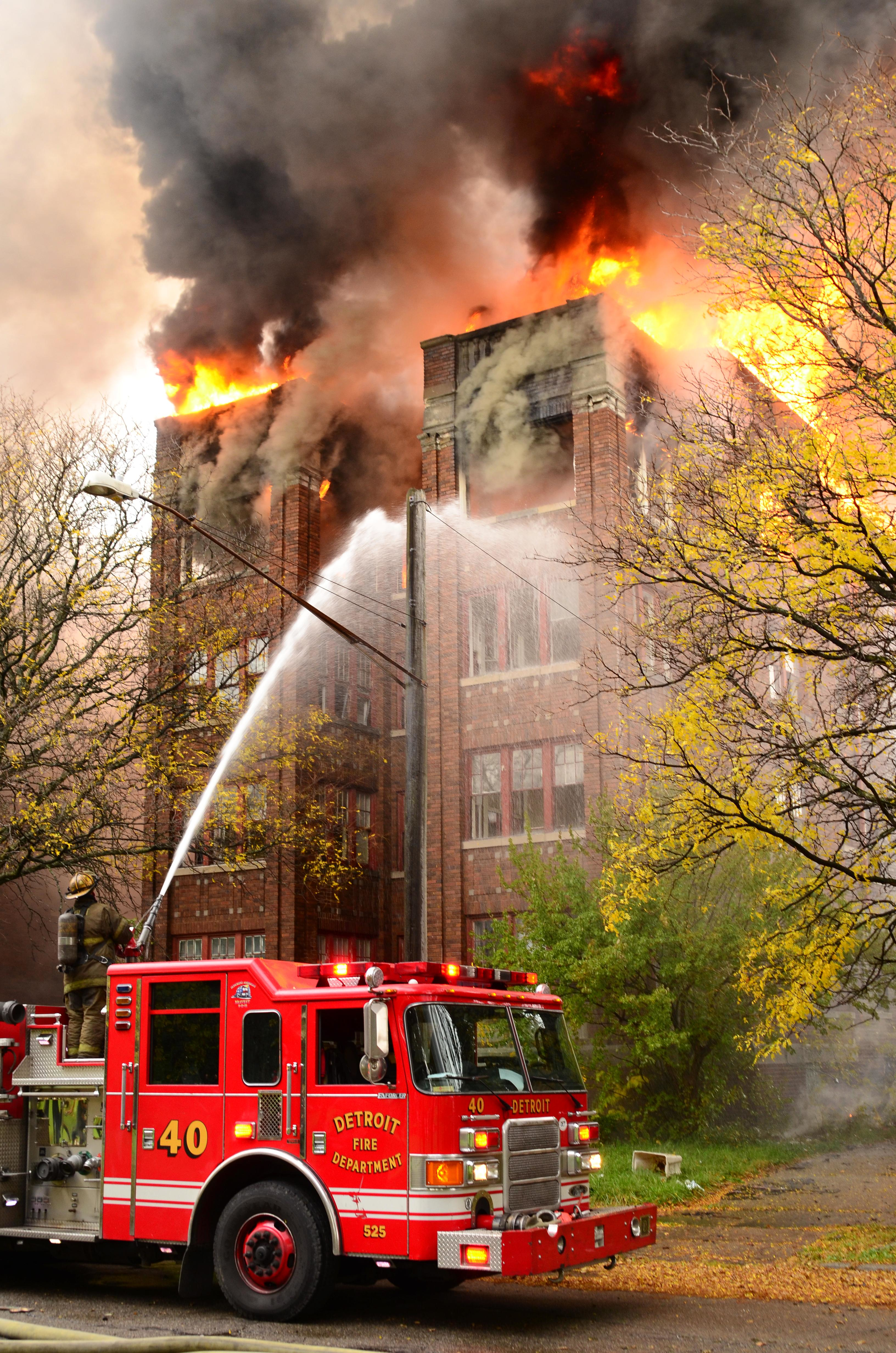 Engine 40 operates its monitor on the A/D corner of the heavily involved vacant apartment building.