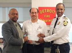 Detroit Executive Fire Commissioner Edsel Jenkins, at left, and Chief Dale Bradley accept the educational grant funds from DVW franchisee Larry Butterfield, at center. Detroit Executive Fire Commissioner Edsel Jenkins, at left, and Chief Dale Bradley accept the educational grant funds from DVW franchisee Larry Butterfield, at center.