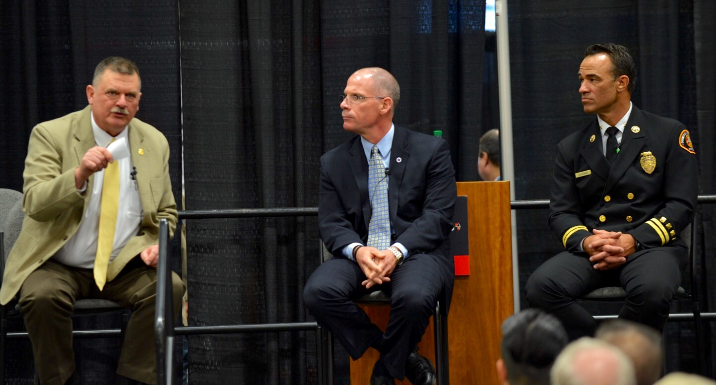 Retired FDNY Battalion Chief John Salka, left, makes a point during a training and tactics session moderated by Tim Sendelbach, center, editor-in-chief of Firehouse, as LA County Battalion Chief Derek Alkonis listens at Firehouse World.