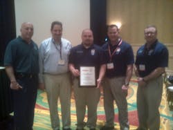 The EVT of The Year Award was presented to David Cottingham, center. He was flanked by (from left to right FDSOA Executive Director Rich Marinucci, Pete Sremac, commercial market manager for C.E. Niehoff &amp; Co., , Lt. Mike Martell, and Capt. David Farmer.